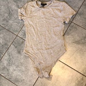 Grey short sleeve body suit with snap closure